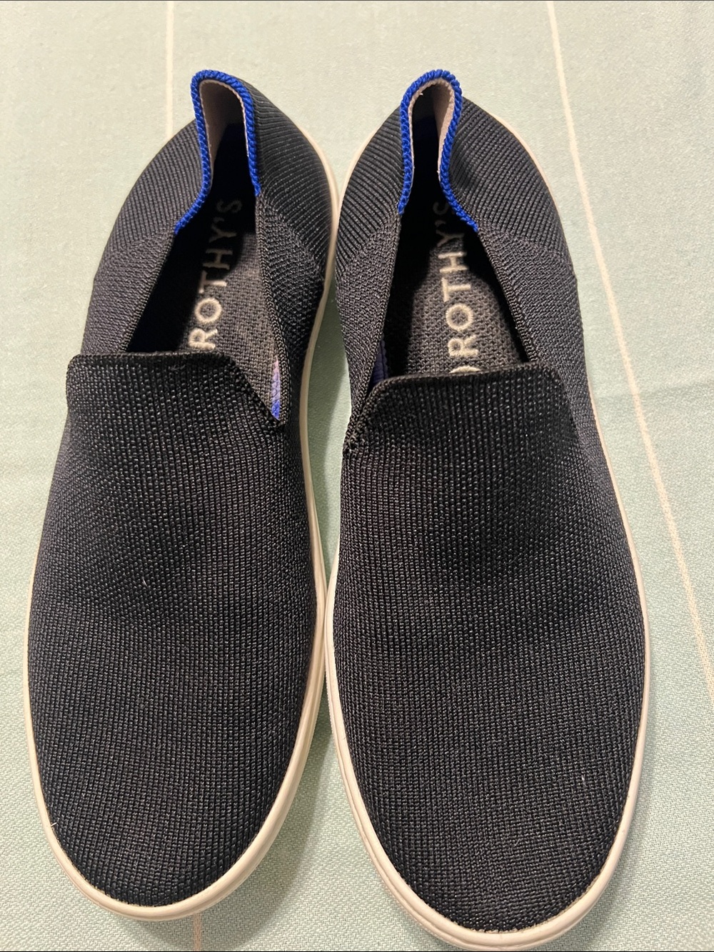 Rothy's Black Knit Slip-On Sneakers with Blue Trim